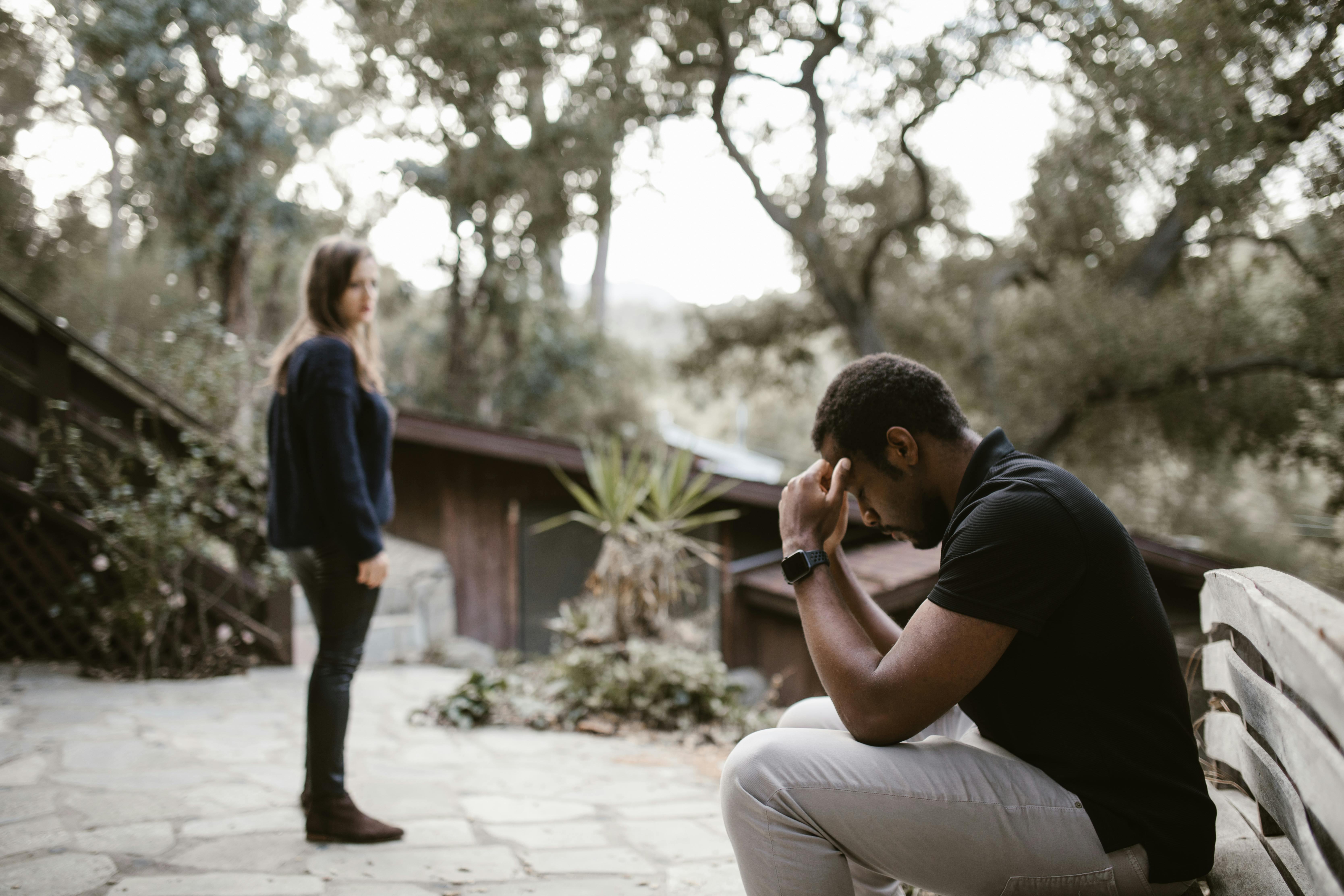 A couple in therapy working through trust issues, showing vulnerability and the process of healing